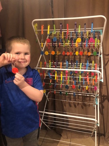 Joey Holmes with his homemade keyrings.